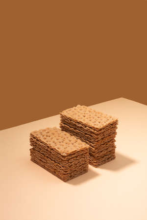 Crispbread on a beige surface, modern isometric creative minimalism concept