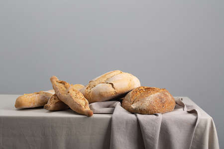 Freshly baked bread on table, gray background