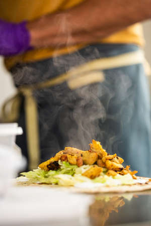 Wine glass and on a white table on a blue curtain backgroundの写真素材