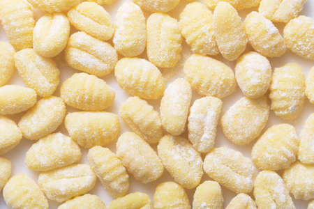 Gnocchi - is Italian, but also South German and Austrian dish. They are dumplings, usually oval, made from wheat flour dough with egg. Potato gnocchi are popular in Abruzzo, Chocharia and other provinces of Lazio. Flat layの写真素材