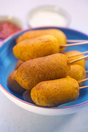 Corn dog cooked with sausage and wheat dough with the addition of corn flour, close up