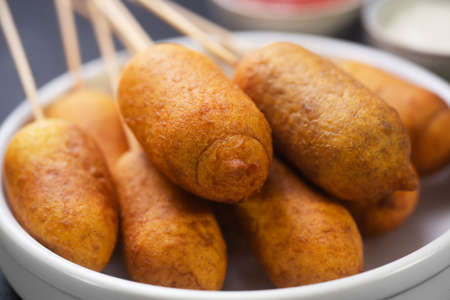 Stack of Corn dog cooked with sausage and wheat dough with the addition of corn flour