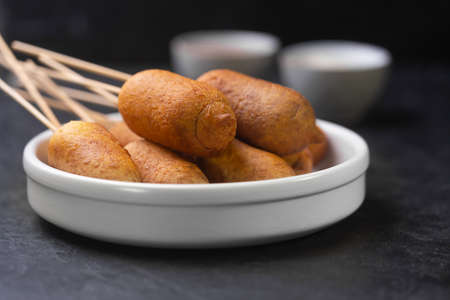 Corn dog cooked with sausage and wheat dough with the addition of corn flour, horizontalの写真素材