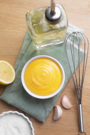 Spanish aioli sauce prepared with garlic, oil and eggs yolk. Aioli is an emulsion or suspension of...