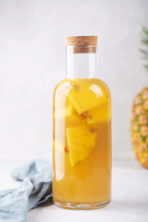 Bottle of tepache, a fermented drink of pineapples and sugar, spicesの写真素材