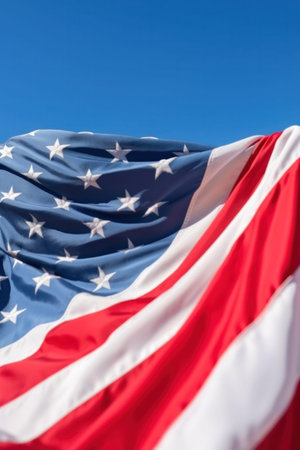 American flag against the backdrop of a blue sky. Generative AIの素材