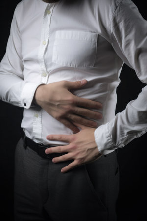 Man put his hands on the abdomen, having stomach ache and nausea. Generative aiの素材