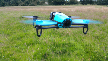 blue drone on the green grass backgroundの写真素材