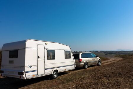 Family vacation travel, holiday trip in motorhome, Caravan car Vacation. Car with caravan ready for...