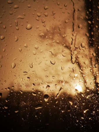 raindrops on the windshield of a vehicle, captured from within Sepia effect