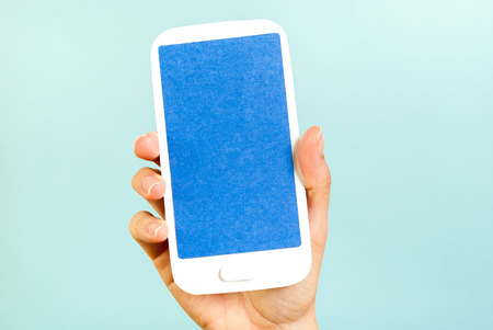 Blue screen vertical mobile concept on blue backgroundの写真素材