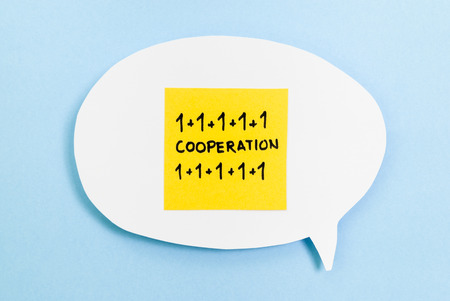 Cooperation concept on speech bubble with blue background