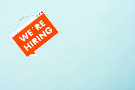 Bubble speech hanging sign with phrase we are hiringの写真素材