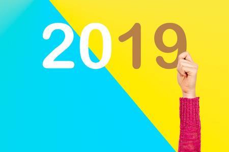 Hand showing a message with new year 2019 conceptの写真素材