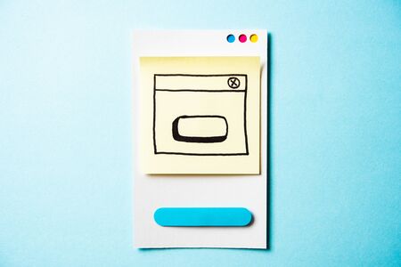 Web app design, creative planning, draft sketch and layout wireframe drawing concept, with paper...