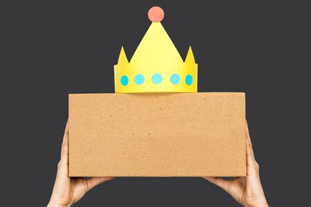 Content marketing concept. Hand holding a box with the word "CONTENT" in front and paper crowdの写真素材