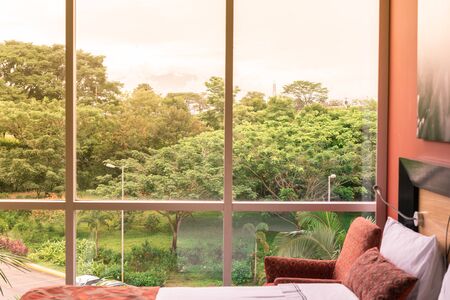 Modern bedroom with nature view in the morning