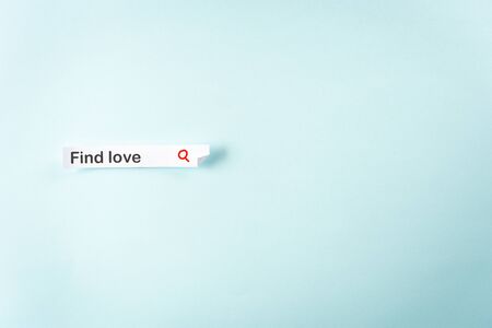 Concept for online internet dating blue background. Paper label like a web input form with the word "Find LOVE" and blank empty space for text.の写真素材