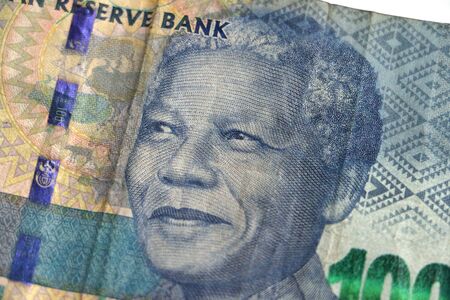Nelson Mandelas face on the South African 100 rand bill money currency
