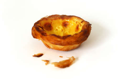 2 delicious sweet Portuguese custard pastry called a pasteis de nata isolated on white background