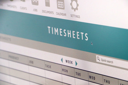 photo of generic digital designed time sheet which I designed on computer screen for tracking business trading hoursの写真素材