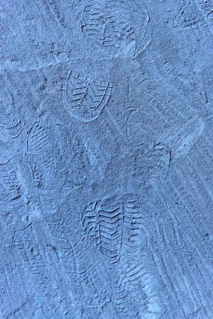 blue sand or concrete on a construction site with sole prints. texture or background for the design. empty spaceの写真素材