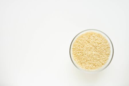 rice in bowl on white backgroundの写真素材