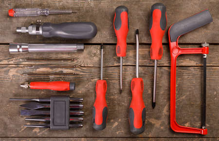 Set of tools on wooden background. Top view with copy space.