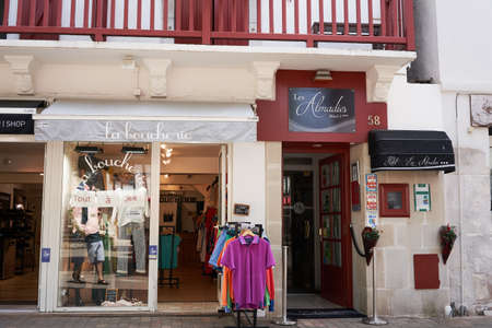 Saint Jean de Luz, France - July 22, 2019 - shopping in the narrow streets - from fashion boutiques to refreshing ice cream.のeditorial素材