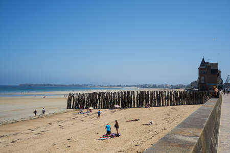 Saint-Malo, France - July 23, 2018 -summer sunny beach of the Atlantic ocean with the ubiquitous windのeditorial素材