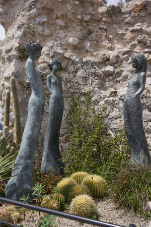 Eze, France - June 17, 2021 - the exotic garden of Eze  with statues of resplendent womenのeditorial素材