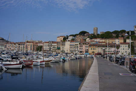 Cannes, France - June 16, 2021 - view of the Old Port - historical site with classic sailboat and modern yachts hosting celebritiesのeditorial素材
