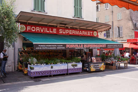 Cannes, France - June 16, 2021 - Forville Market is Cannes' favorite market and offers organic vegetables, local wine, fresh fish, and fresh flowers for the table.のeditorial素材