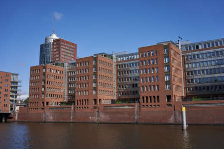 Hamburg, Germany - July 18, 2021 - development in the port of Hamburg near the Elbe Philharmonic - Am Kaiserkai street - in the sunny summer morningの写真素材