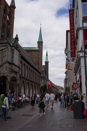 Luebeck, Germany - July 20, 2021 - The dark bricks of the Town Hall make a striking contrast to the traditional red-brick constructionのeditorial素材