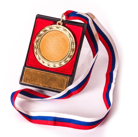 Old gold medal for firs places with box and award ribbon.の写真素材