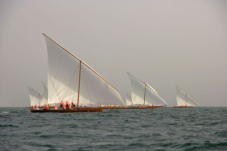 Racing traditional dhows in the Arabian Gulf off Dubai.の写真素材