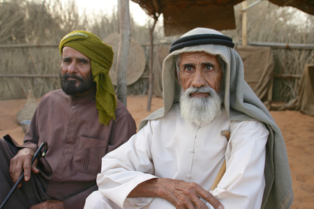 Two Arab men at their camp near Dubai. The older man on the right is blind.のeditorial素材
