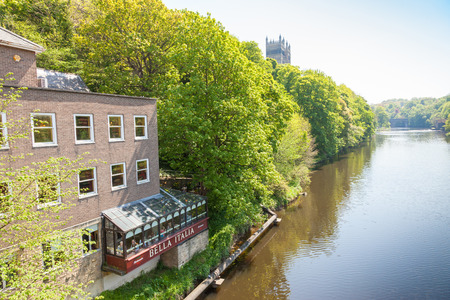 DURHAM, UK - MAY 22, 2012: Diners in a restaurant overlooking the banks of the River Wear in Durham, England.のeditorial素材