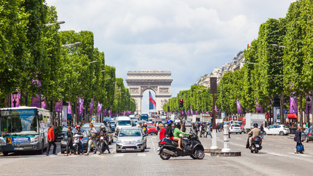 PARIS, FRANCE - JUNE 8, 2012: The Avenue des Champs-Elysees, the most famous avenue in the world, stretches for two kilometres from the Place de la Concorde to the Place Charles de Gaulle, the site of the Arc de Triomphe in Paris.のeditorial素材