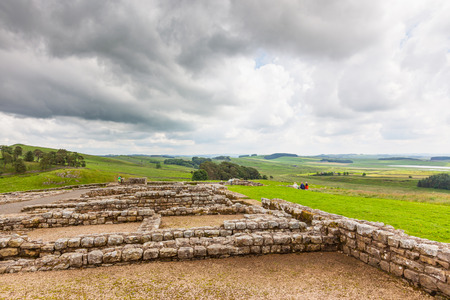 NORTHUMBERLAND, ENGLAND - JULY 7, 2012: The remains of Housesteads Roman Fort, part of Hadrian's Wall in Northumberland, England.のeditorial素材