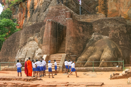 SIGIRIYA ROCK, SRI LANKA - SEPTEMBER 6, 2003: Schoolchildren exploring the ancient Sri Lankan rock fortress of Sigiriya, a UNESCO World Heritage Site.のeditorial素材