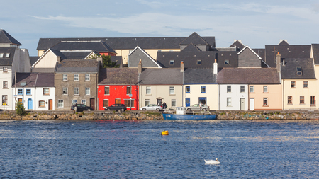 GALWAY, IRELAND - AUGUST 16, 2012: A late-afternoon summer view across the River Corrib towards The Long Walk in Galway, Ireland.のeditorial素材