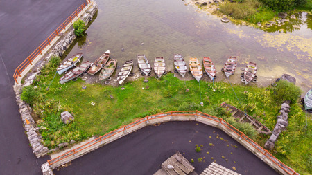 An aerial view of rowing boats at Kilbeg Pier near Headford in County Galway, Ireland.