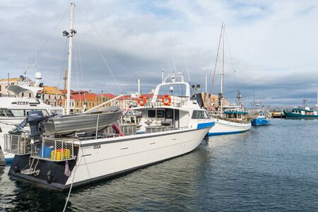 TASMANIA, AUSTRALIA - FEBRUARY 16, 2019: Fishing boats moored at Elizabeth Street Pier in Hobart in Tasmania, Australia.のeditorial素材