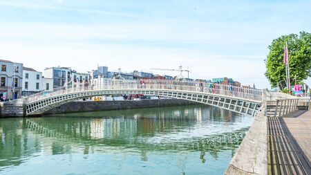 DUBLIN, IRELAND - AUGUST 1, 2019: Halfpenny Bridge over River Liffey, Dublin,  Ireland.のeditorial素材