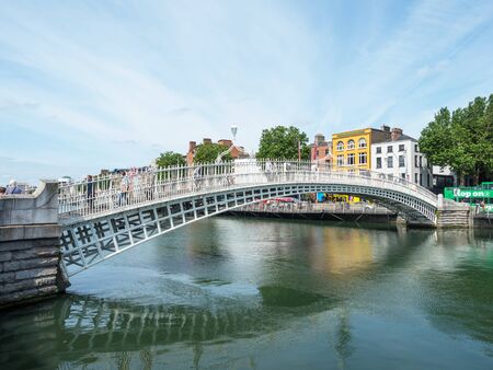 DUBLIN, IRELAND - AUGUST 1, 2019: Halfpenny Bridge over River Liffey, Dublin,  Ireland.のeditorial素材