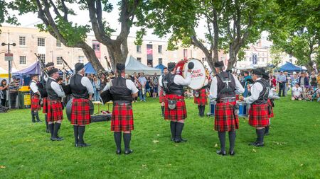 HOBART, AUSTRALIA - FEBRUARY 16, 2019: The City of Hobart Highland Pipe Band performing at the renowned Salamanca Market in Hobart in Tasmania, Australia.のeditorial素材