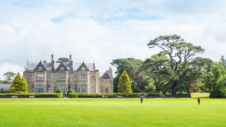 KILLARNEY, IRELAND - AUGUST 13, 2019: Muckross House, the core of Killarney National Park, is a...