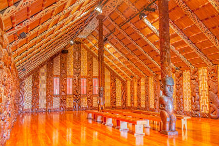 WAITANGI, NEW ZEALAND - JUNE 1, 2010: Traditional Maori carvings in the interior of Te Whare Runanga, the Maori Meeting House, in Waitangi, North Island, New Zealand.のeditorial素材
